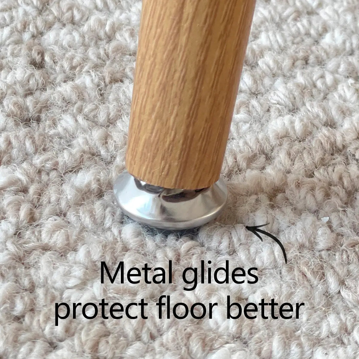 Metal glide on Nice Rattan Chair leg protects carpet floor, improving durability and style.