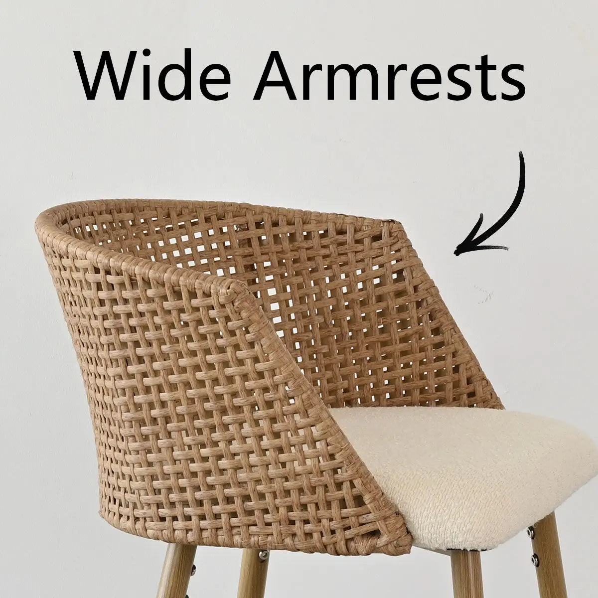 Beige Rattan Curved-Back Counter Stool with Wide Armrests against Neutral Wall.