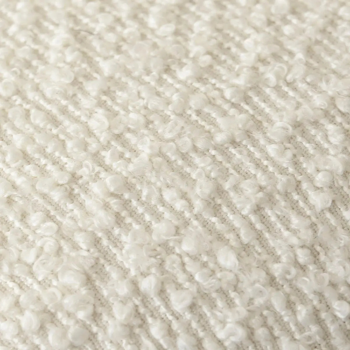 Close-up texture of Nice Modern Rattan Upholstered Counter Stool upholstery fabric in cream color.