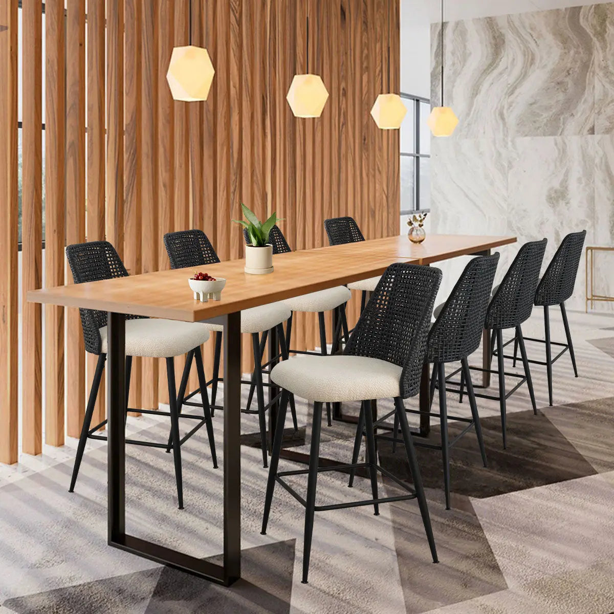 Nice Modern Rattan Upholstered Counter Stool in dining room with wood panel walls, geometric pendant lights.