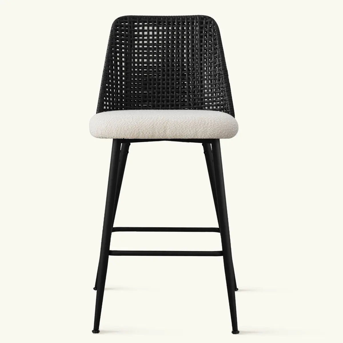 Front view of contemporary rattan counter stool with upholstered seat, black frame, minimalist style.