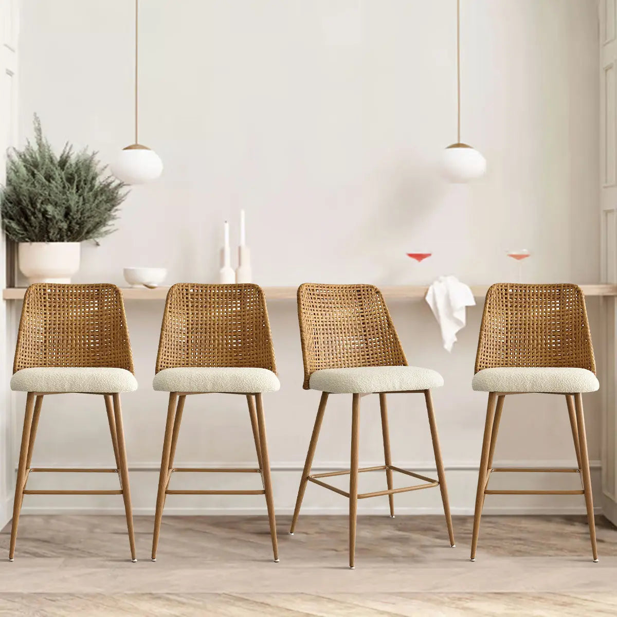 Nice 27" rattan counter stools set of 4 in modern kitchen with light wood flooring.