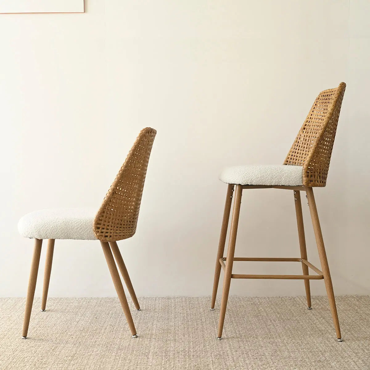 Nice Modern Rattan Upholstered Counter Stool, beige cushion, woven back, neutral carpet flooring, minimalist room.