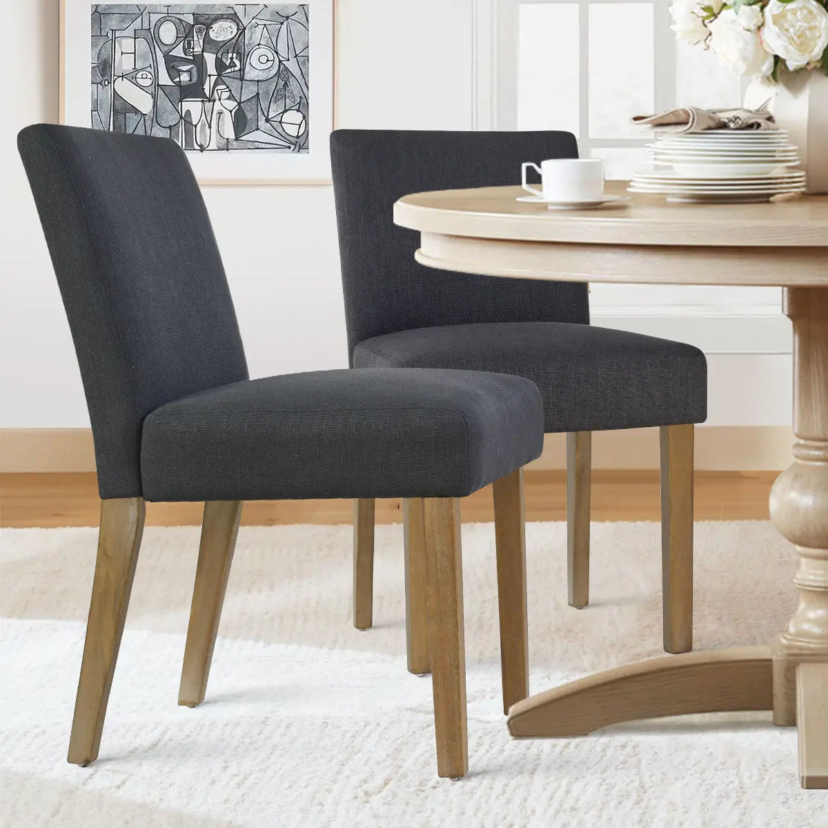 North Upholstered Dining Chair, gray with wooden legs, round table, dining room setting.