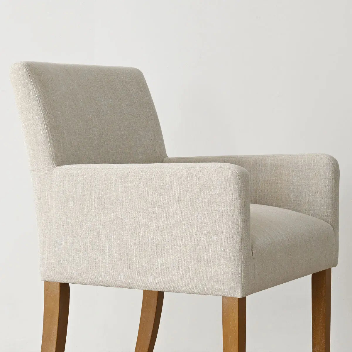 North Modern Boucle Upholstered Armchair with wooden legs, minimalist design, neutral background.