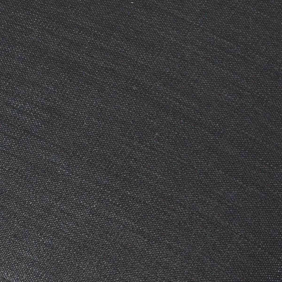 Textured black upholstery detail of North Modern Boucle Armchair, close-up fabric view.