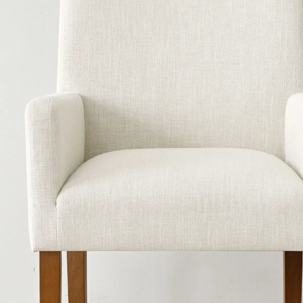 North Modern Boucle Armchair with wooden legs, upholstered in beige fabric, minimalistic design.