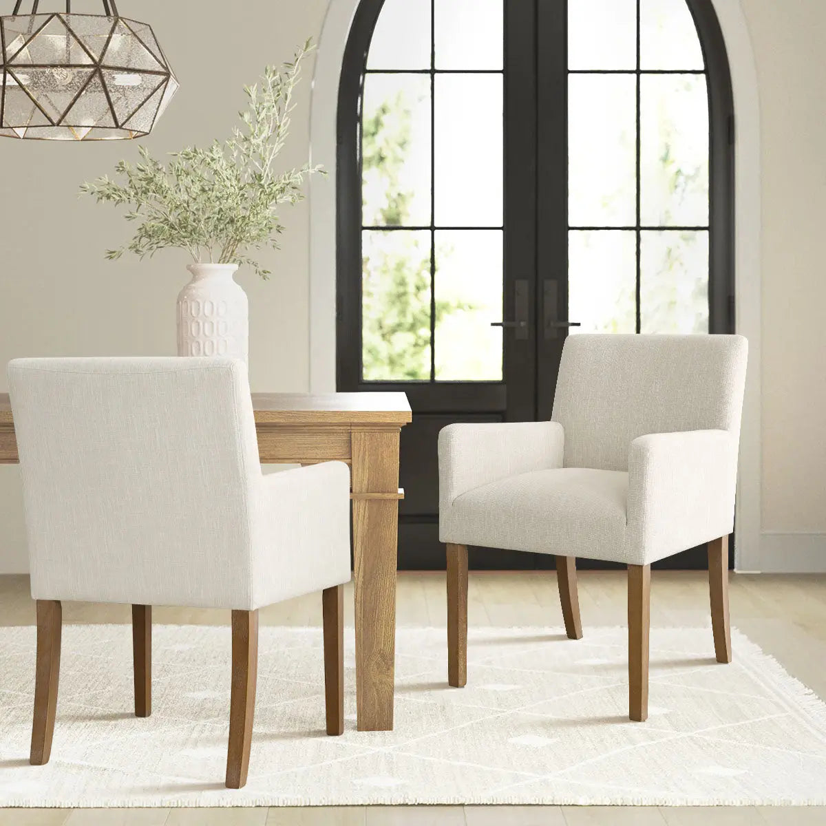 North Modern Boucle Upholstered Armchair, wooden dining table, neutral walls, white textured rug, elegant decor.