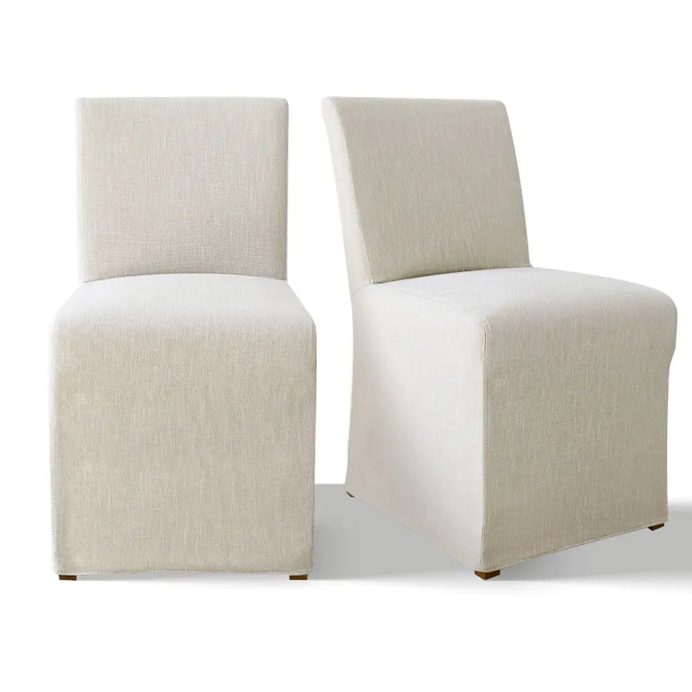 North Beige dining chairs with removable slipcovers; modern design, white background, wooden floor.