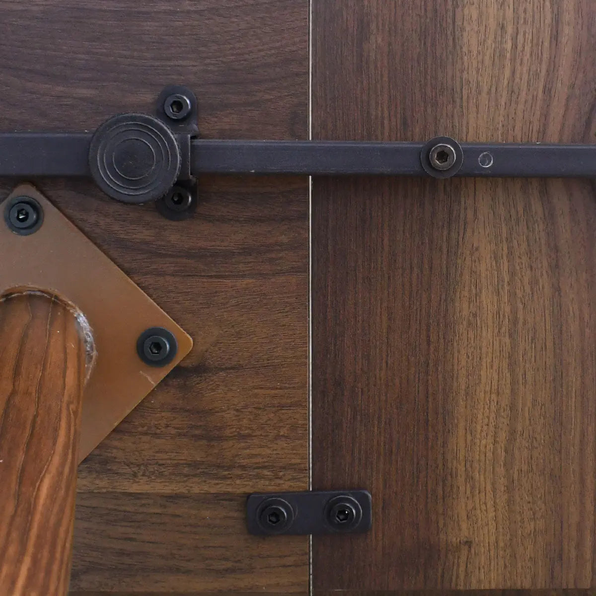 Close-up of Odense Extendable Dining Table wood grain and hardware details.