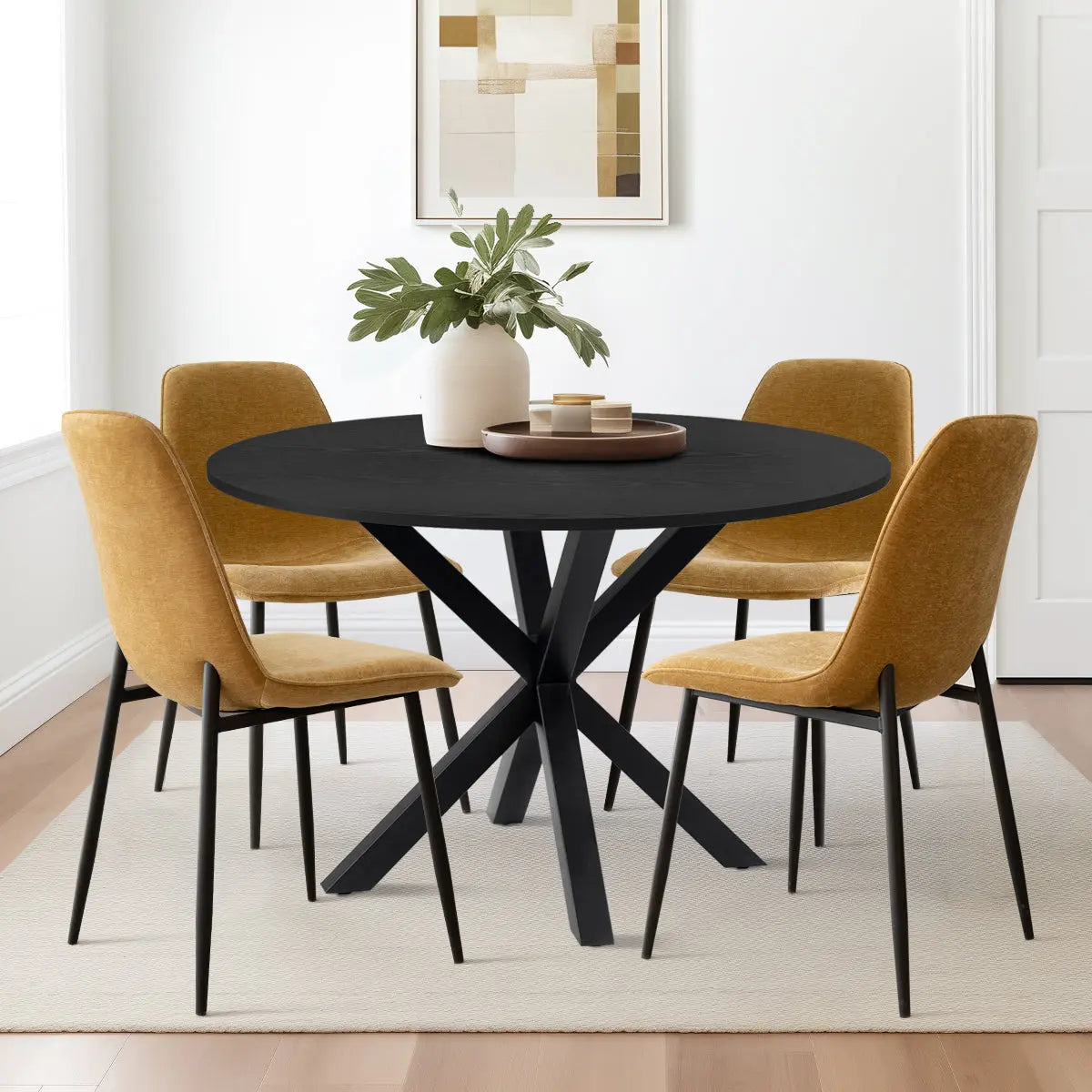 Oliver & Oslo Round Dining Table Set, mustard chairs, neutral wall, light wood floor, modern dining room.