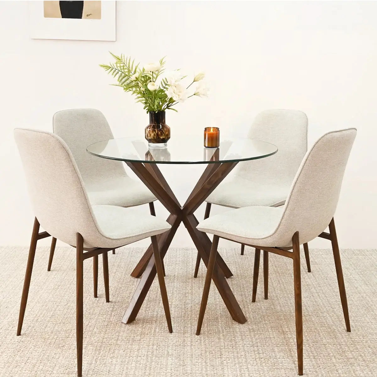 Oliver & Oslo Glass Round Dining Table Set with beige chairs, neutral wall, and carpet flooring.