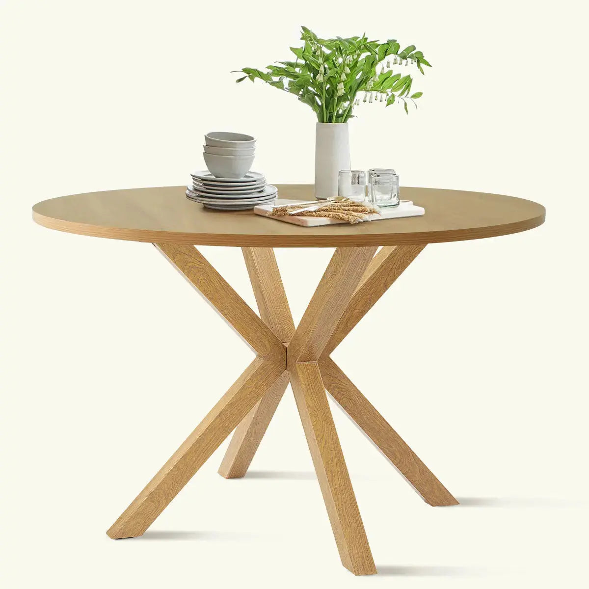 Oliver Modern Round Dining Table with wooden legs, minimalist style, showcasing elegant dining room furniture.