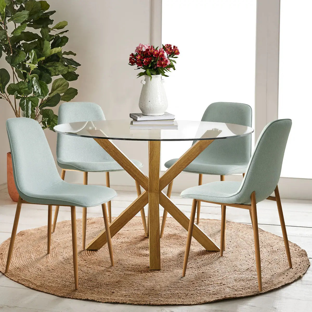 Oliver & Oslo Glass Dining Table Set, light green chairs, modern living room, wooden flooring, beige walls.