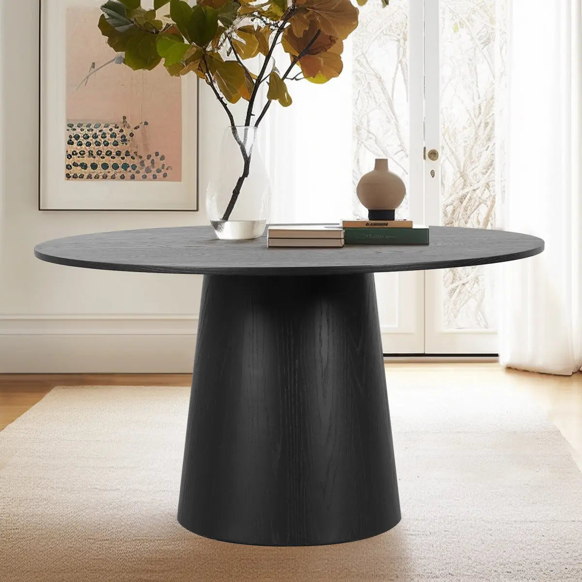 Orchid Solid Oak Round Pedestal Dining Table in modern room with rug and minimal decor.