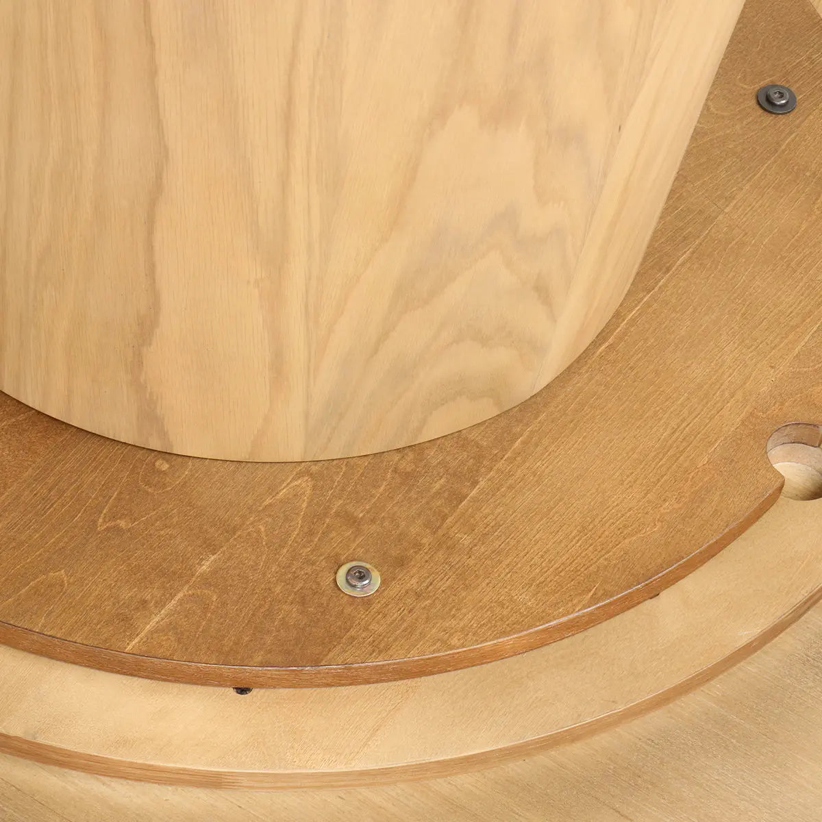 Close-up of Orchid Solid Oak Wood Round Pedestal Dining Table base, light oak finish.