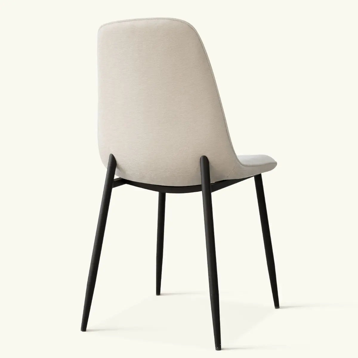 Oslo Modern Upholstered Dining Chair with Metal Legs in a minimalistic room setting.