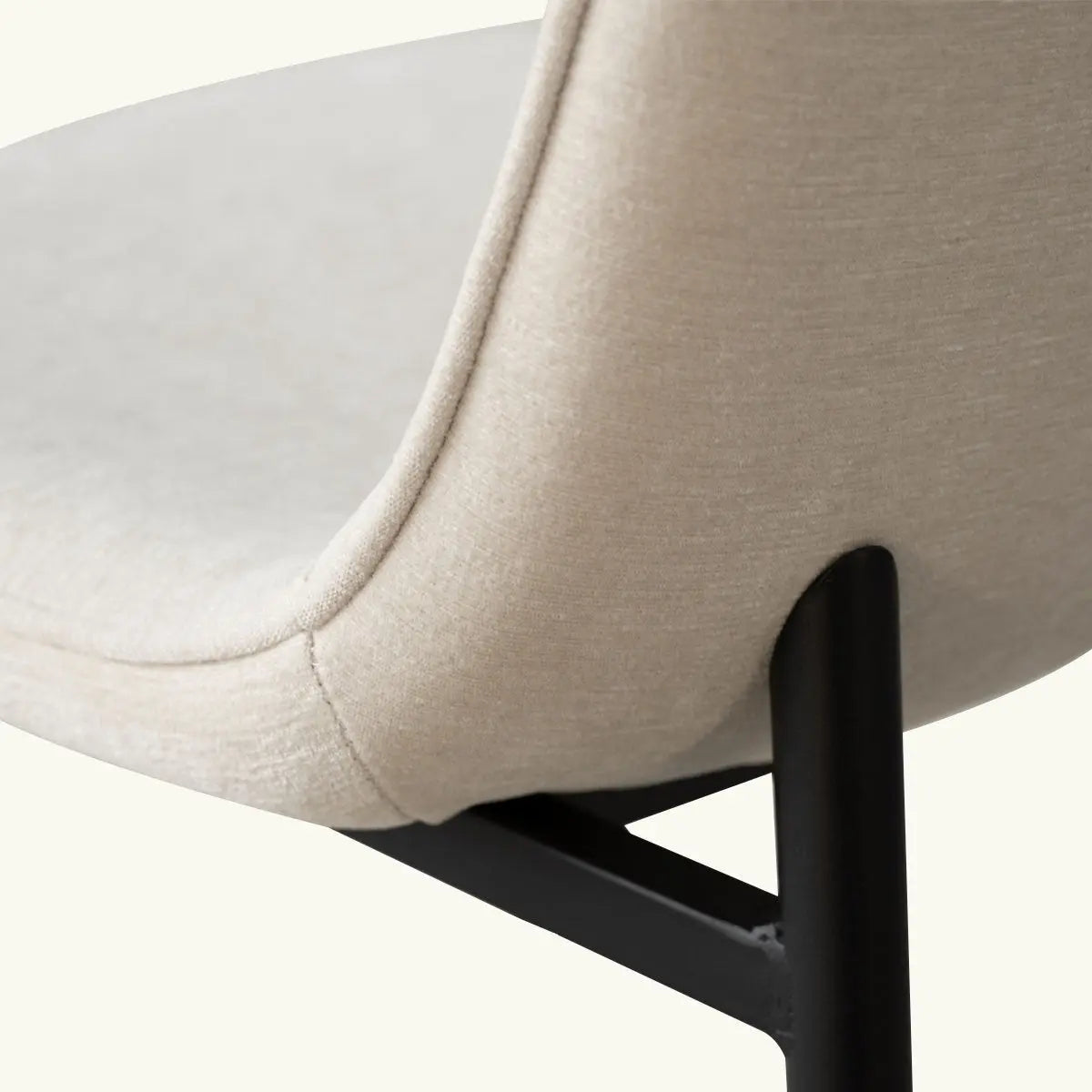 Beige Oslo Modern Upholstered Dining Chair detail, metal legs, padded fabric, contemporary design.