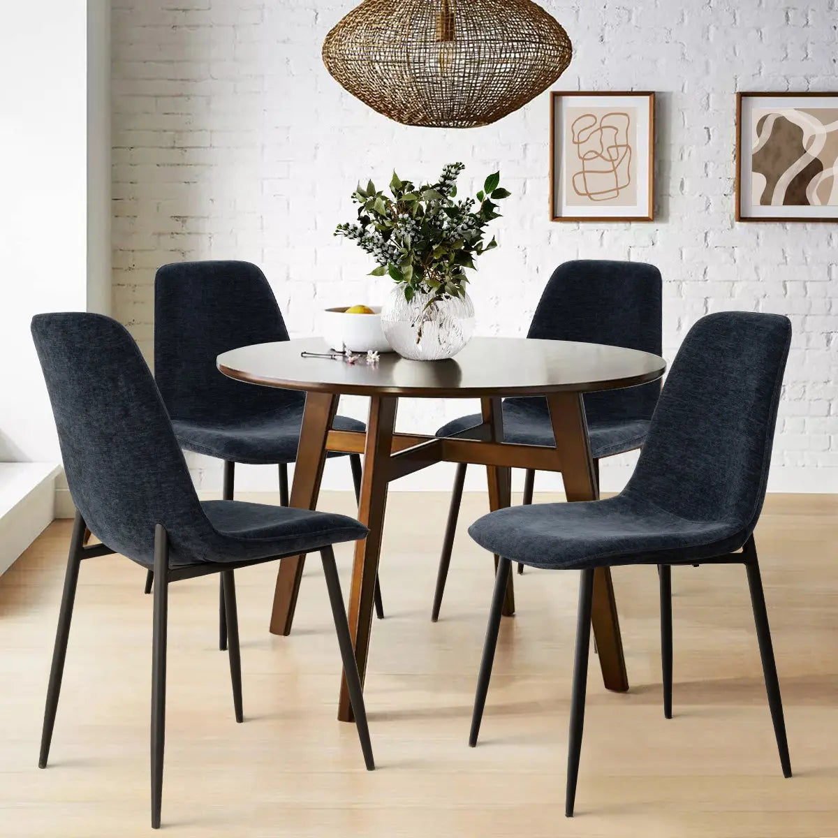 Oslo Modern Upholstered Dining Chair in stylish dining room with round table, light wood flooring.