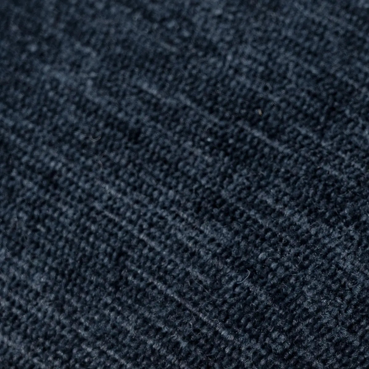 Close-up fabric texture of Oslo Modern Upholstered Dining Chair, dark navy upholstery.