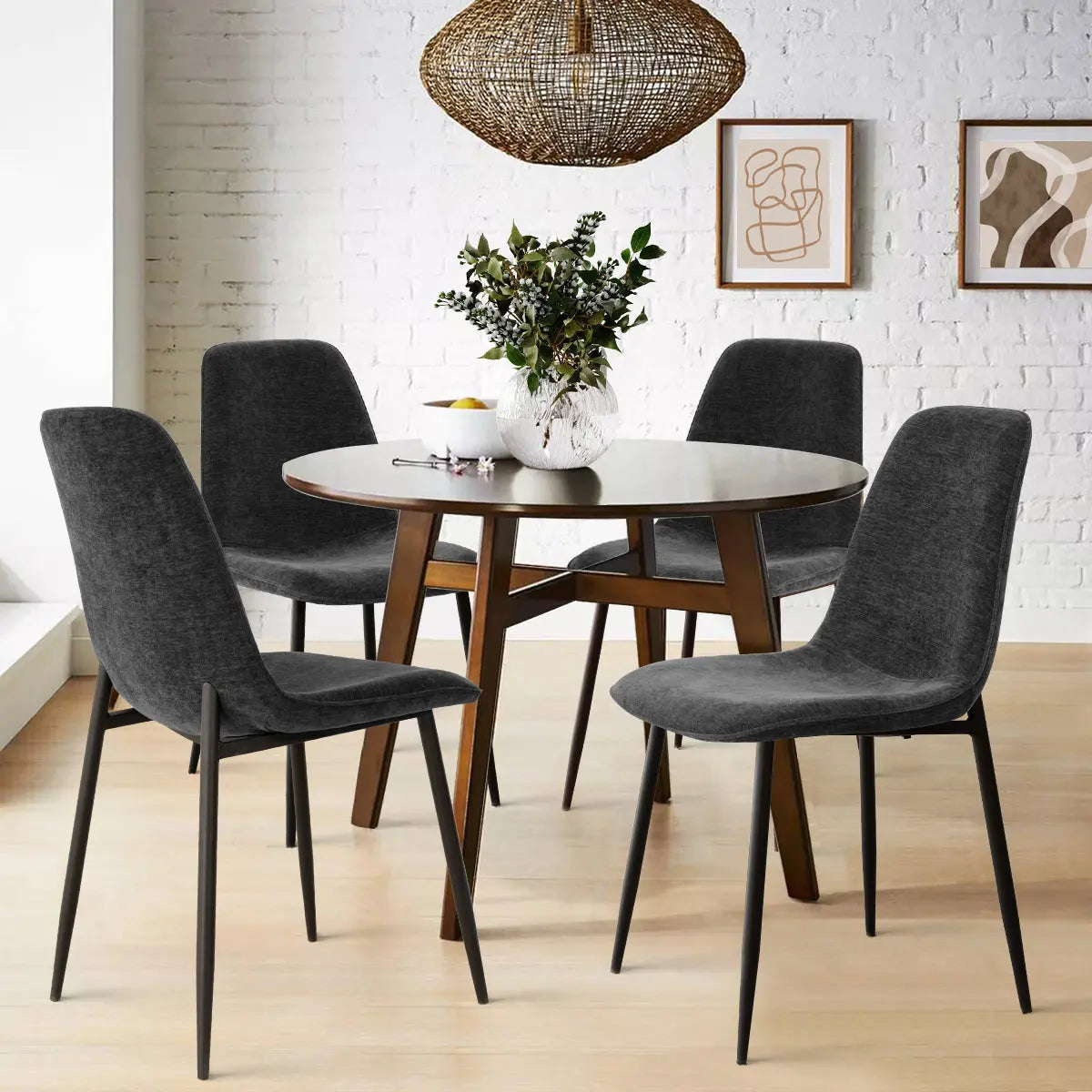 Oslo Modern Upholstered Dining Chair with Metal Legs in elegant dining room with white brick walls.