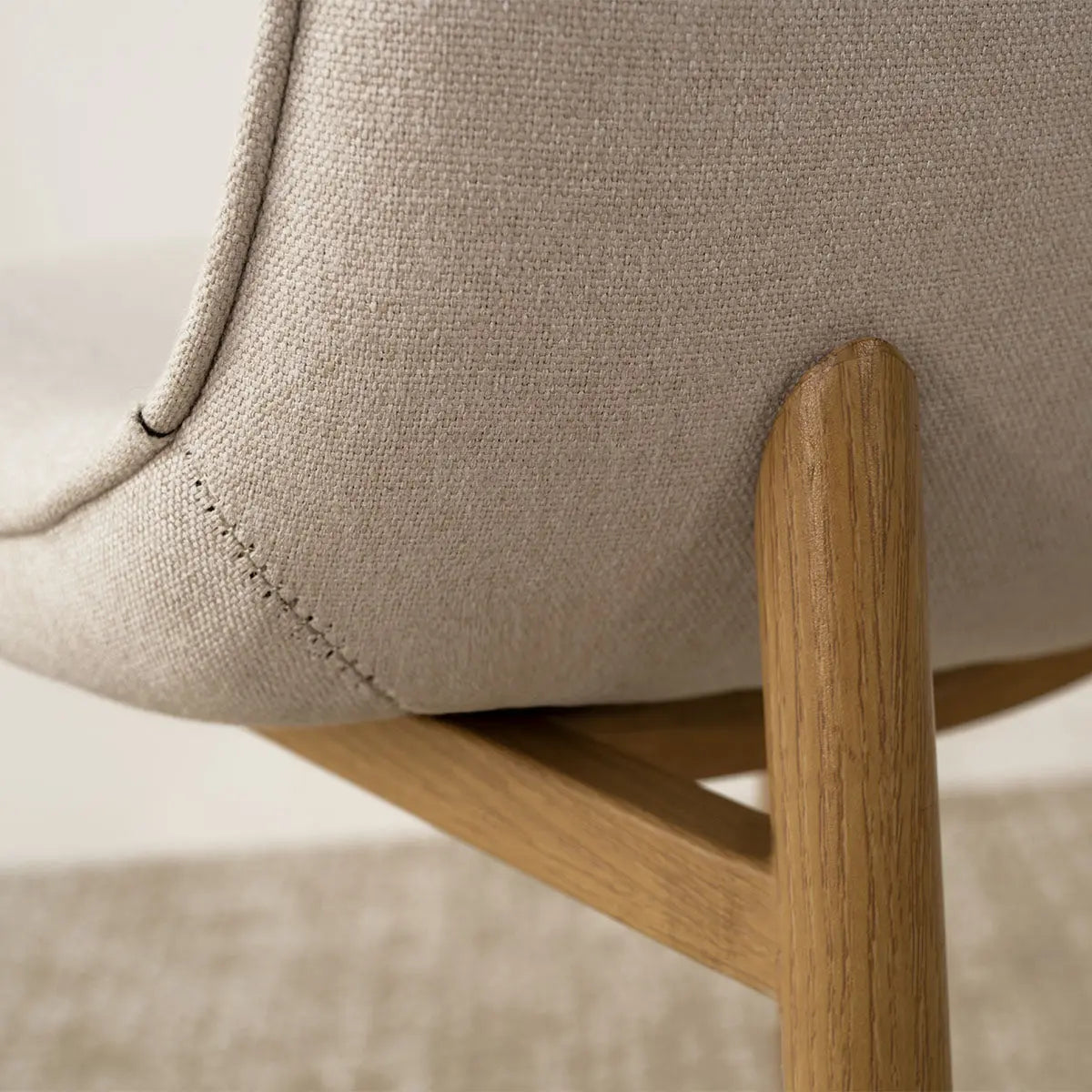 Oslo Modern Chenille Dining Chair, oak legs detail, beige upholstery, close-up of texture and design.