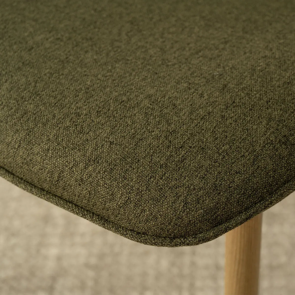 Oslo Modern Chenille Dining Chair with oak legs, textured olive fabric, close-up view.