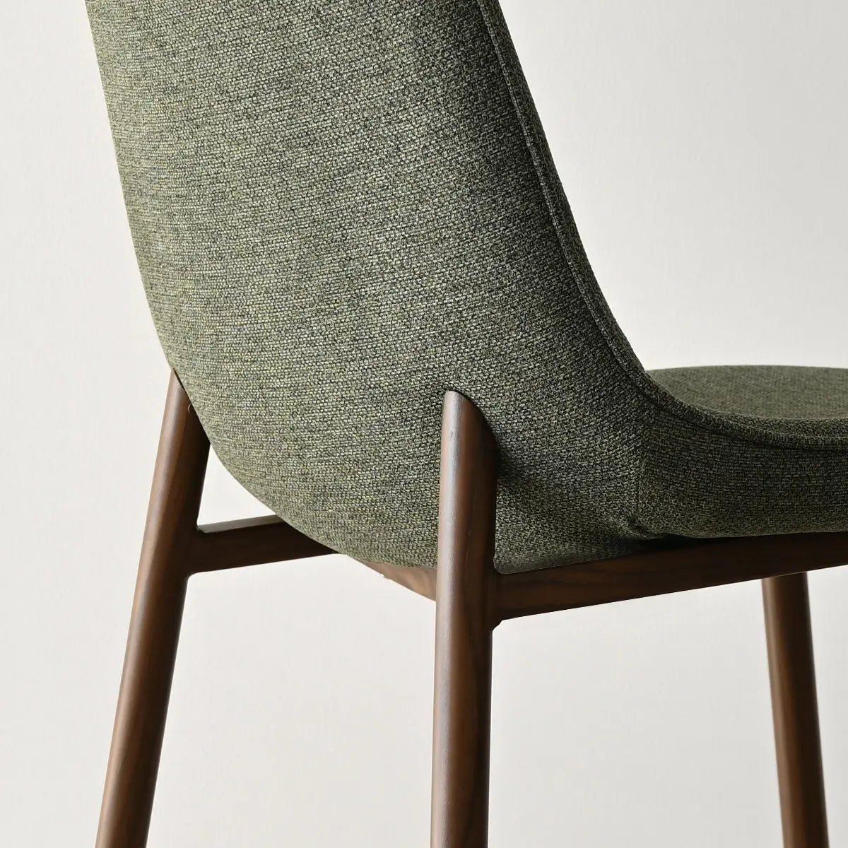 Oslo Modern Upholstered Dining Chair, walnut legs, green fabric, clean minimalist design, comfortable seating.