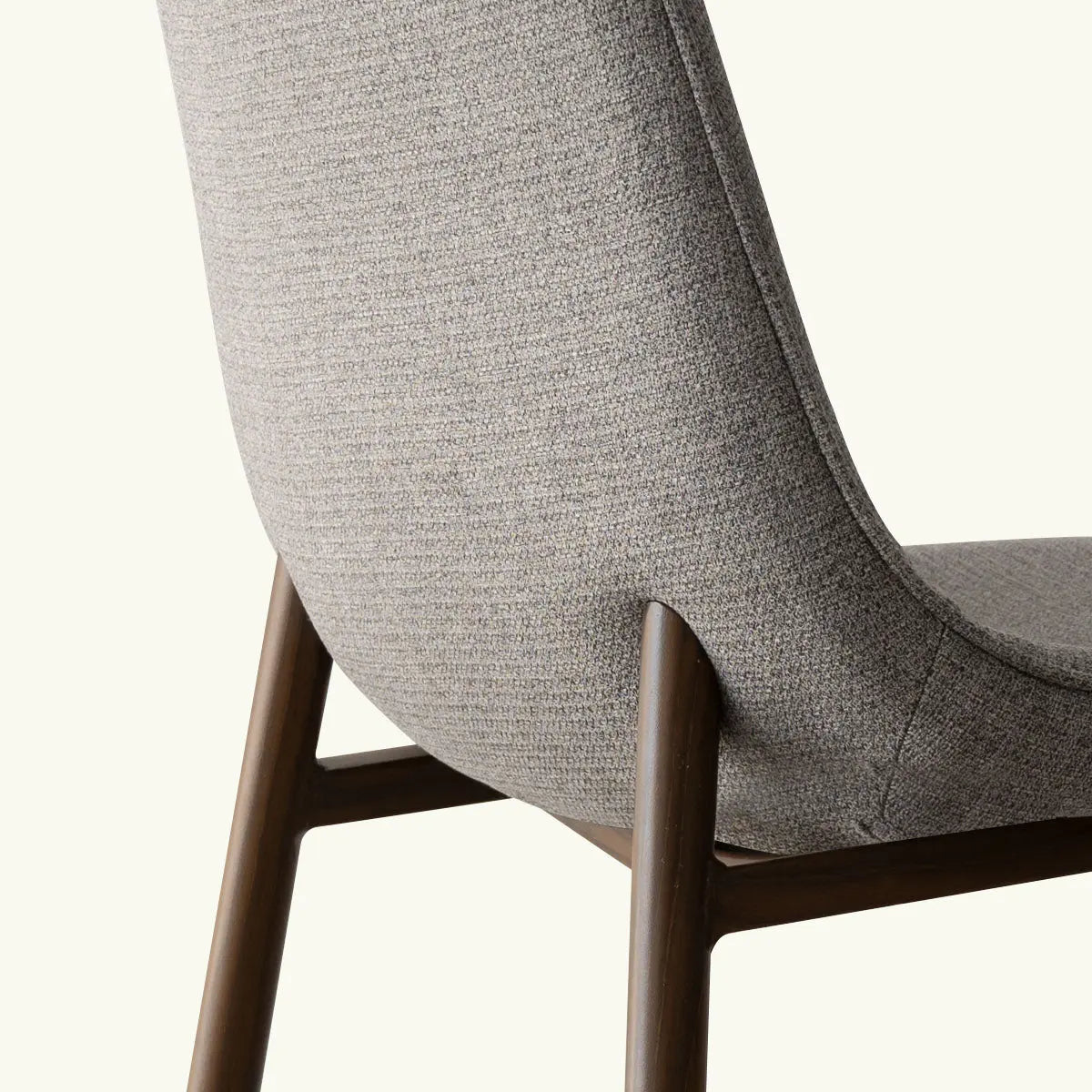 Oslo Modern Upholstered Dining Chair with walnut legs, textured fabric close-up view.