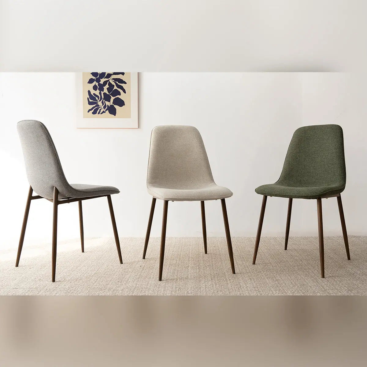 Oslo Modern Upholstered Dining Chair set with walnut legs, beige walls, and textured carpet flooring.