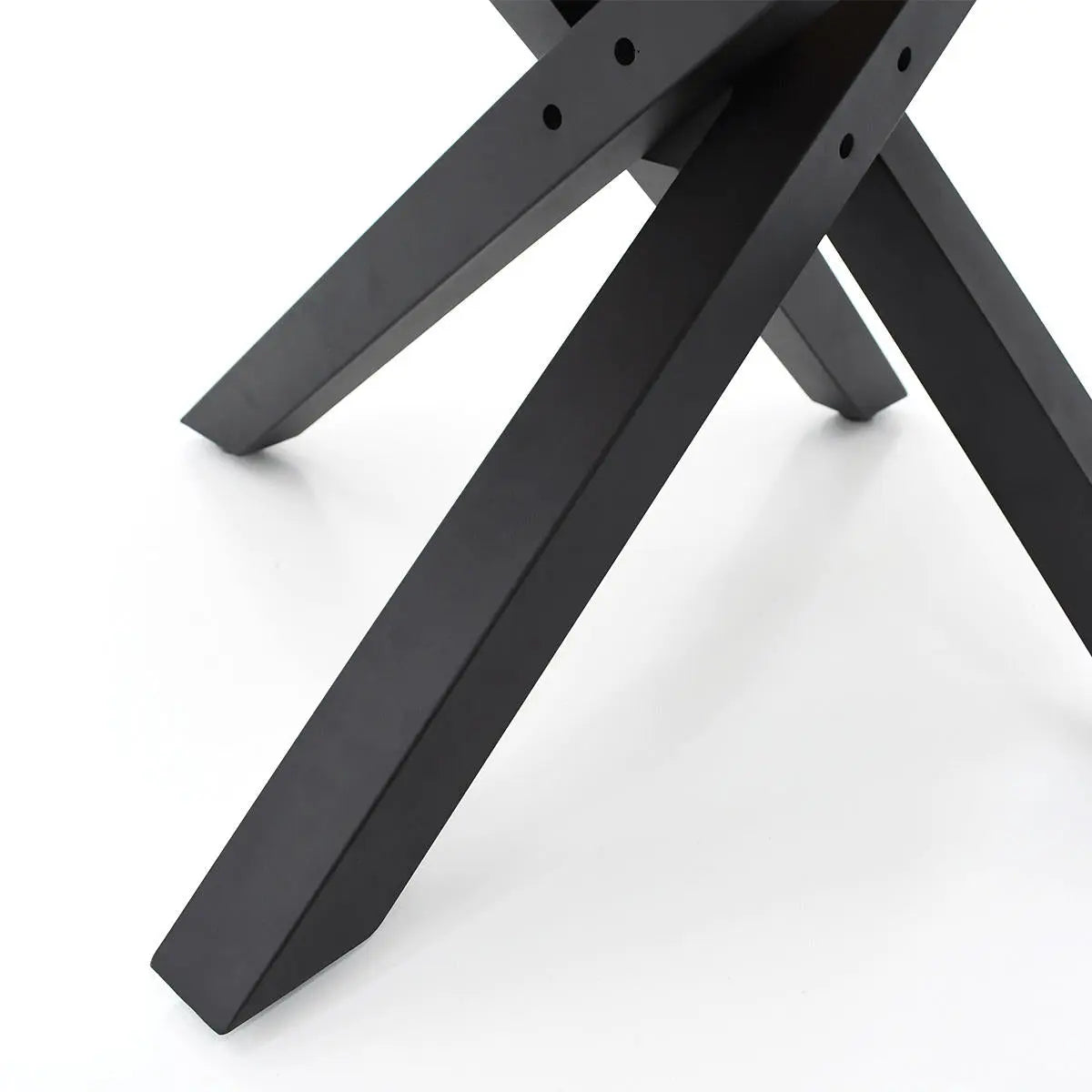 Close-up of black legs on Thomas & Grey Robert Modern Round Dining Table, sleek design, minimalistic style.