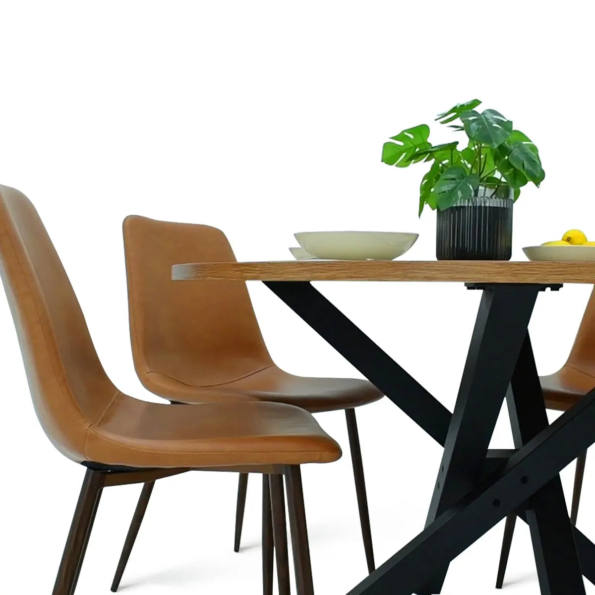 Robert Modern Round Dining Table with tan chairs, black legs. Dining room furniture set.