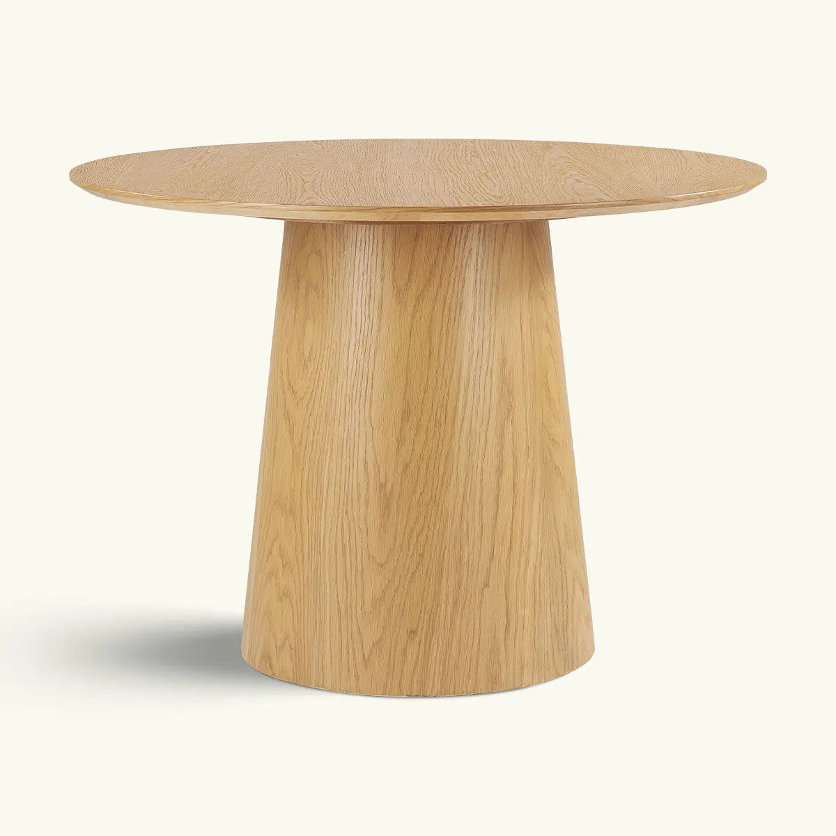 Saigong Oak Round Dining Table with natural finish, featuring a sleek design and sturdy base.