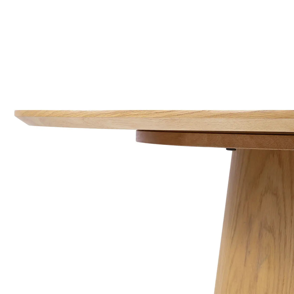 Close-up of Saigong Oak Round Dining Table showcasing natural wood finish and craftsmanship.