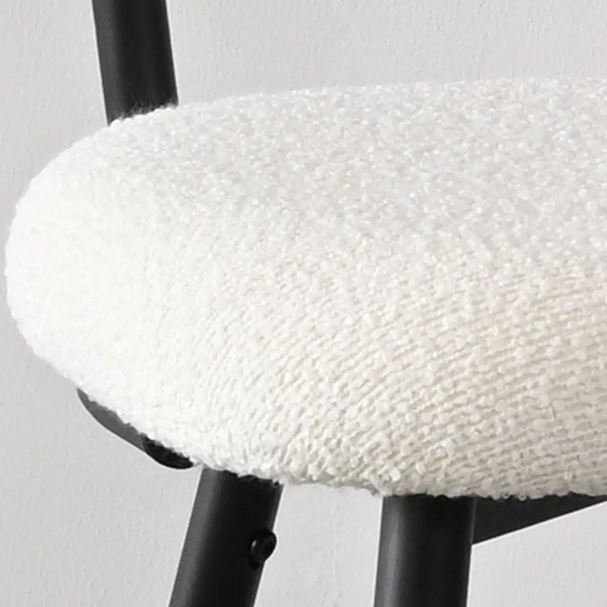 Close-up of Skagen Beige Boucle Counter Stool seat with subtle texture on metal legs.