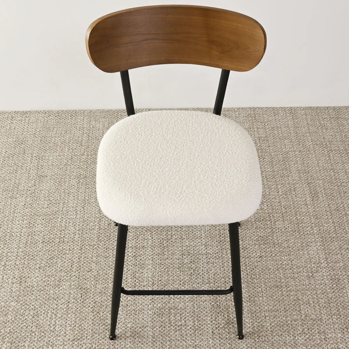 Skagen Beige Boucle Counter Stool with Ash Back on textured carpet flooring in neutral setting.