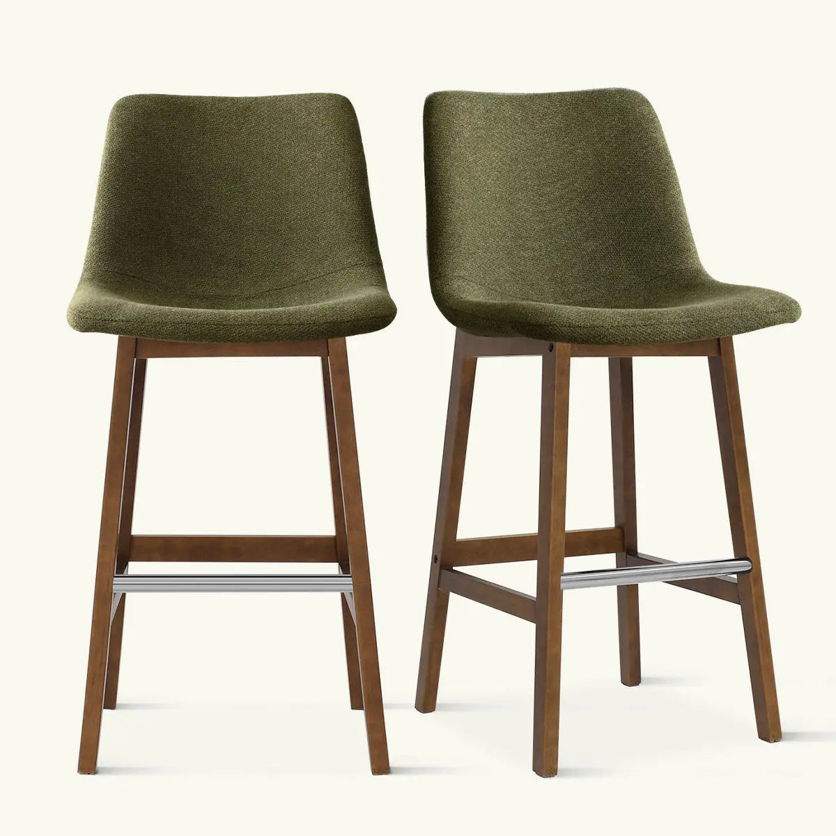 Pair of green South Modern Upholstered Counter Stools with wood legs against plain background.