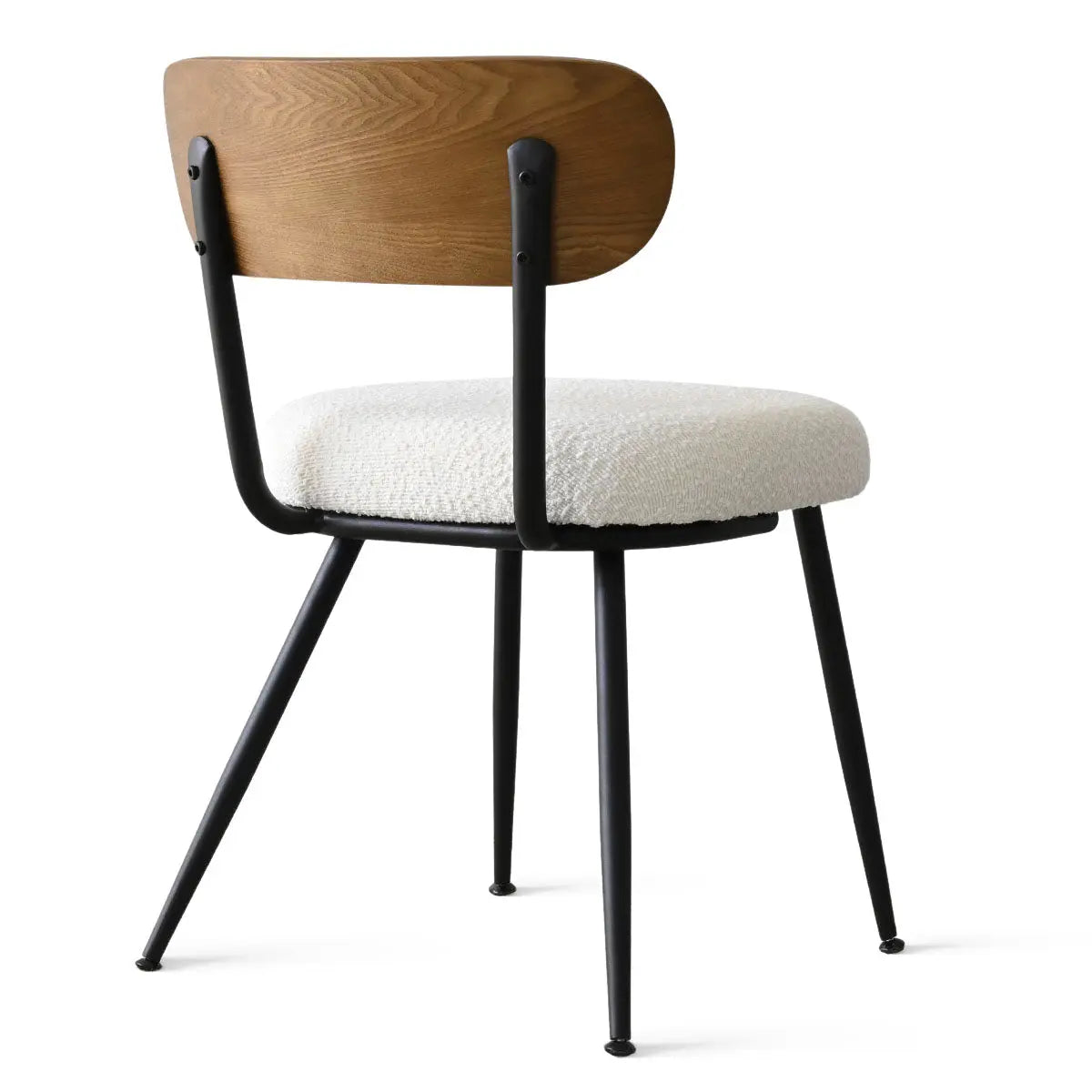 Skagen dining chair with ash back, beige boucle upholstery, black metal legs, contemporary design.