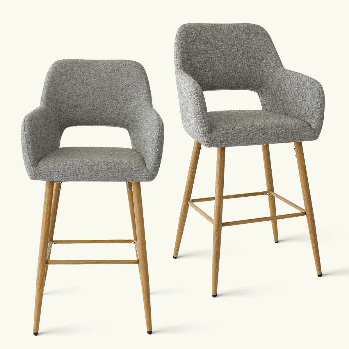 Pair of gray upholstered counter stools with wooden legs, modern design. Atlanta, no background.