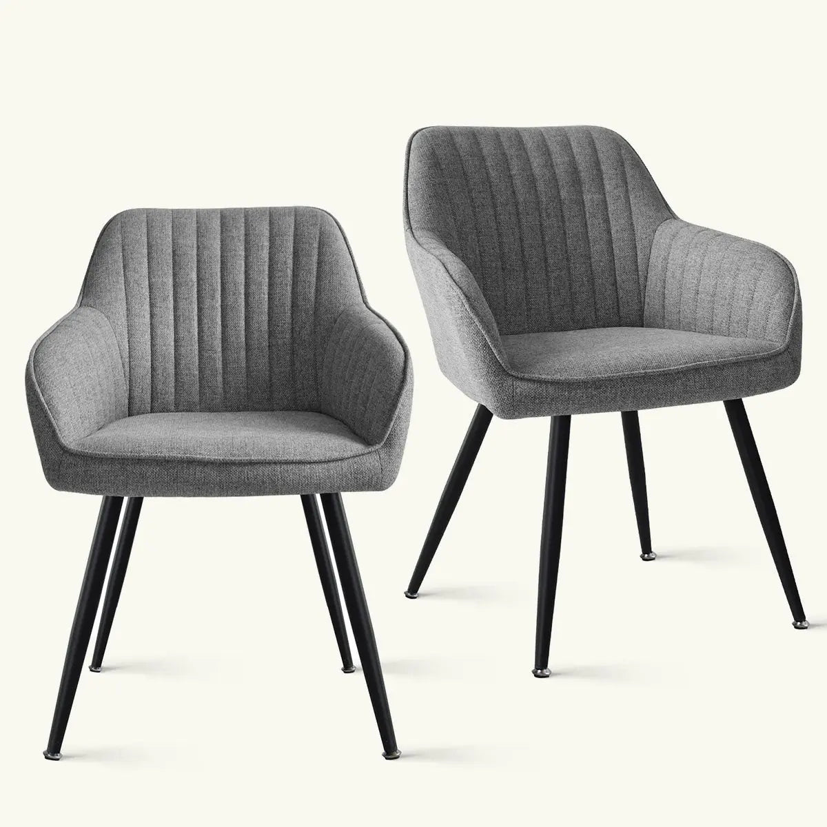 Two Boston Modern Upholstered Dining Chairs with Arms, featuring sleek black legs and gray fabric.