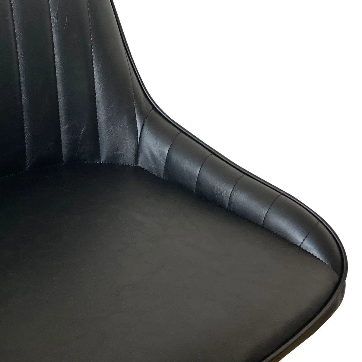 Close-up of Boston Leather Upholstered Dining Chair, black leather with stitched detailing.