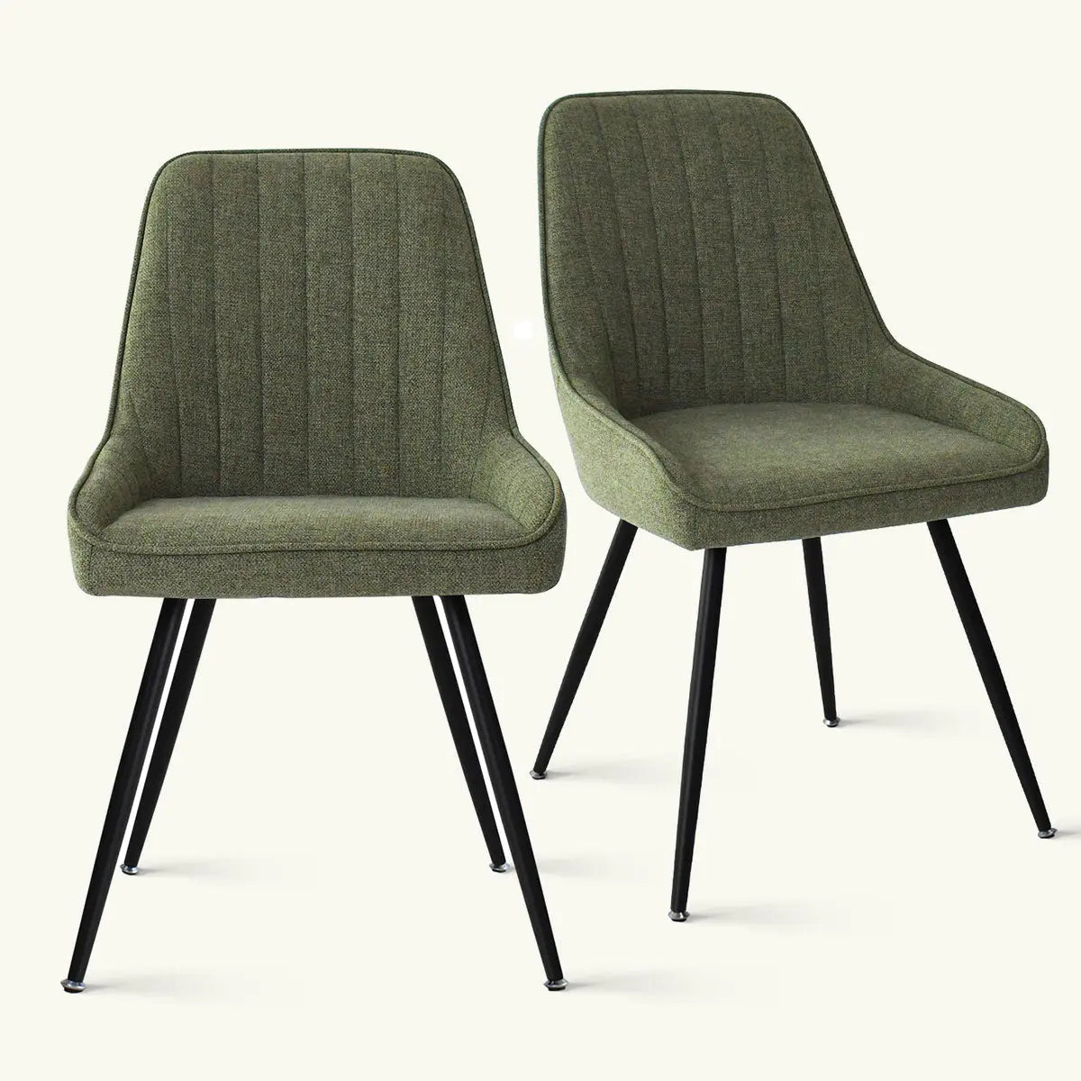 Green upholstered dining chairs with black legs, featuring Boston Modern design; elegant seating solution.