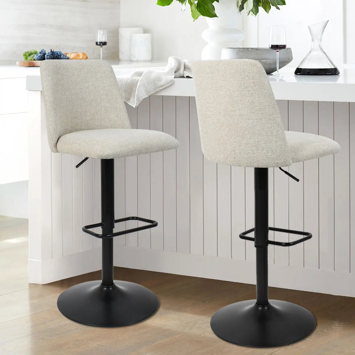 Bruno Modern Upholstered Swivel Adjustable Stool, light kitchen, wood flooring, white cabinetry, bar setting.