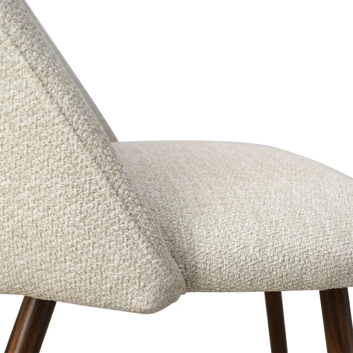 Edwin Modern Boucle Upholstered Dining Chair close-up, showcasing texture and walnut wood legs.