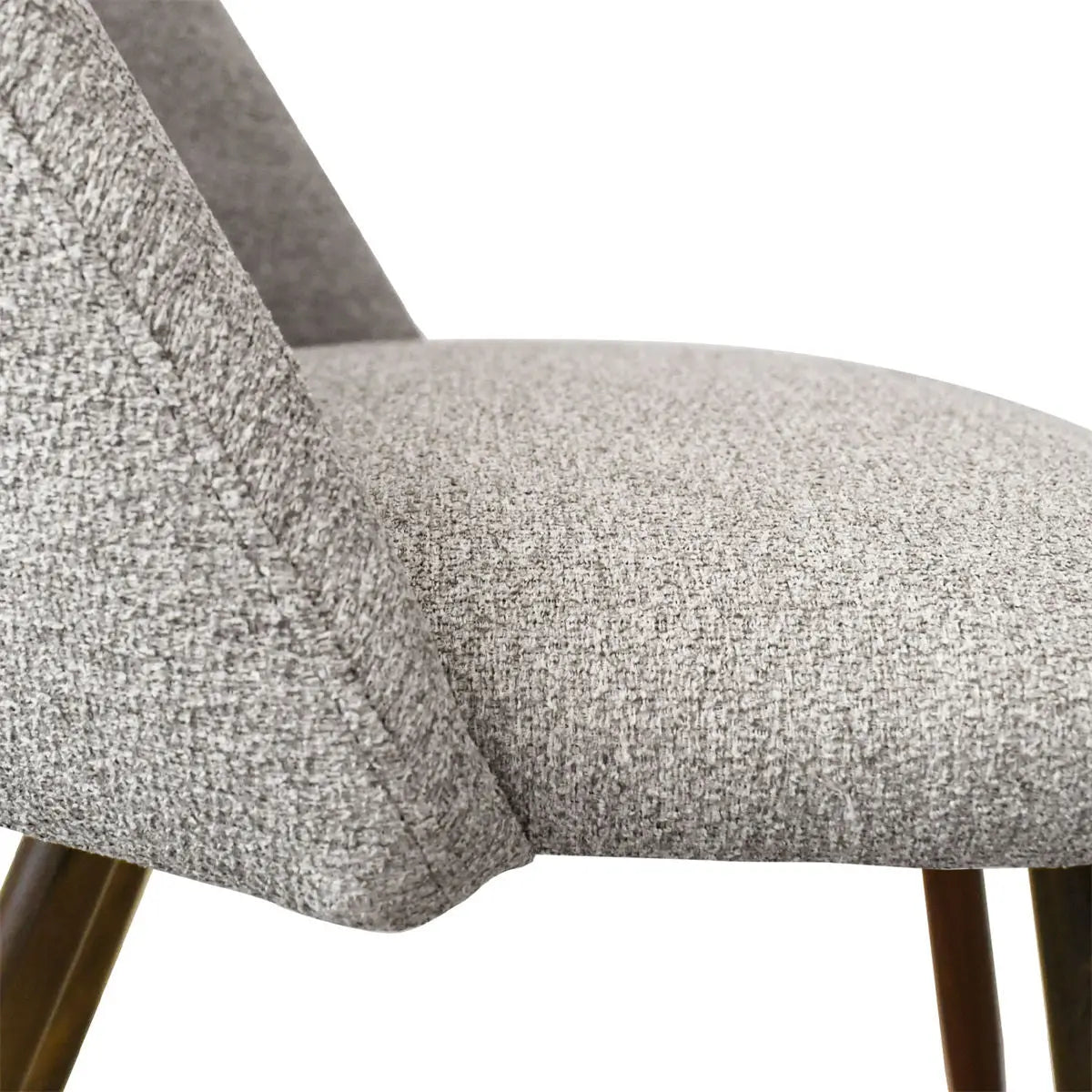 Edwin Modern Boucle Dining Chair with textured upholstery and wooden legs, close-up side view.