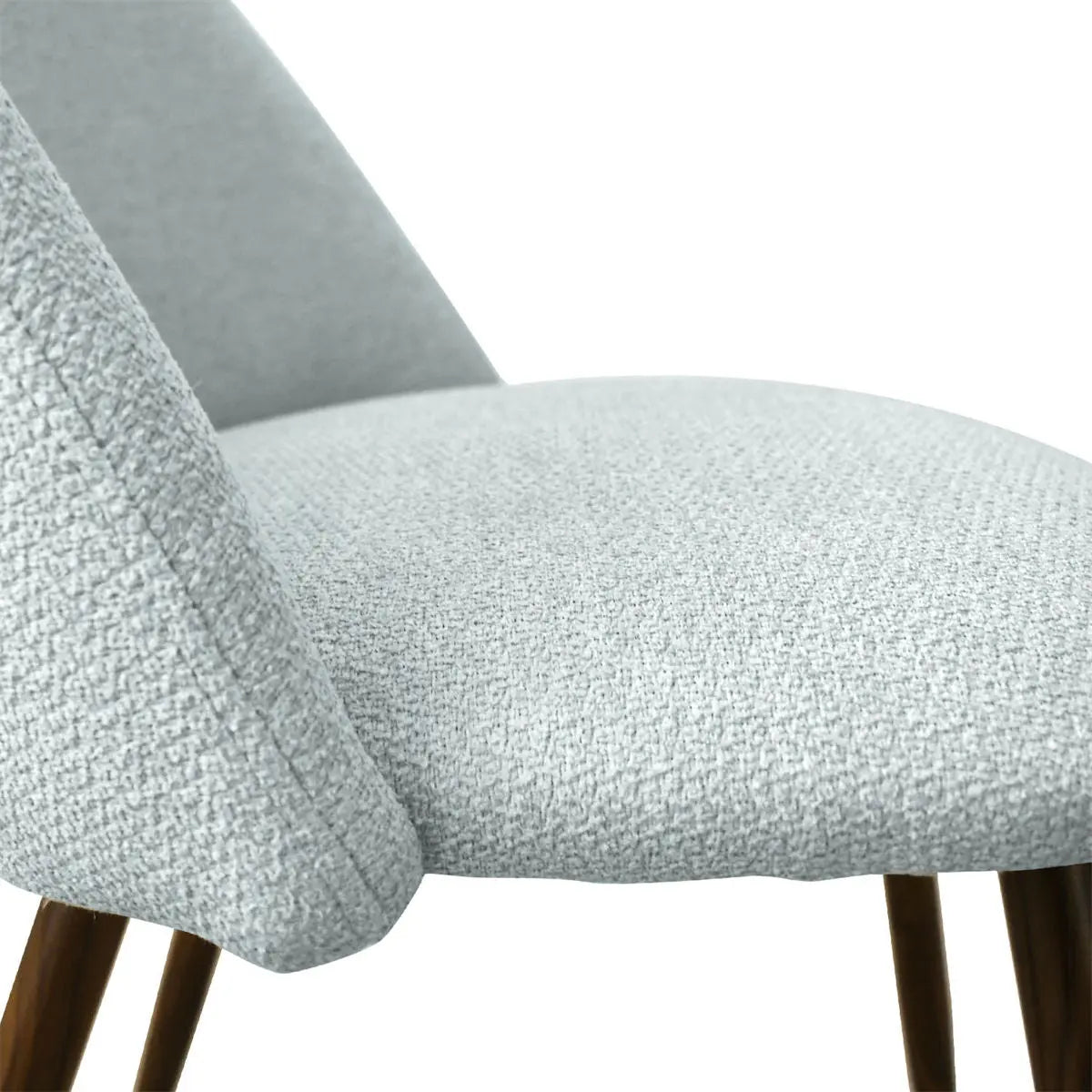 Close-up of Edwin Modern Boucle Upholstered Dining Chair fabric texture, highlighting clean, elegant design.