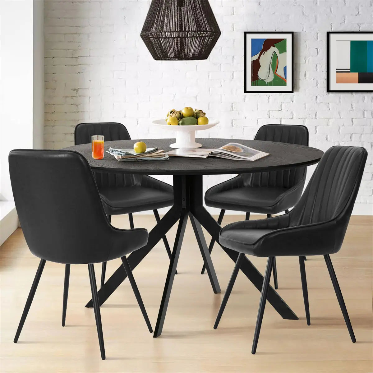 Jonesbo & Boston dining set with black chairs, round table, white brick wall, modern lighting.