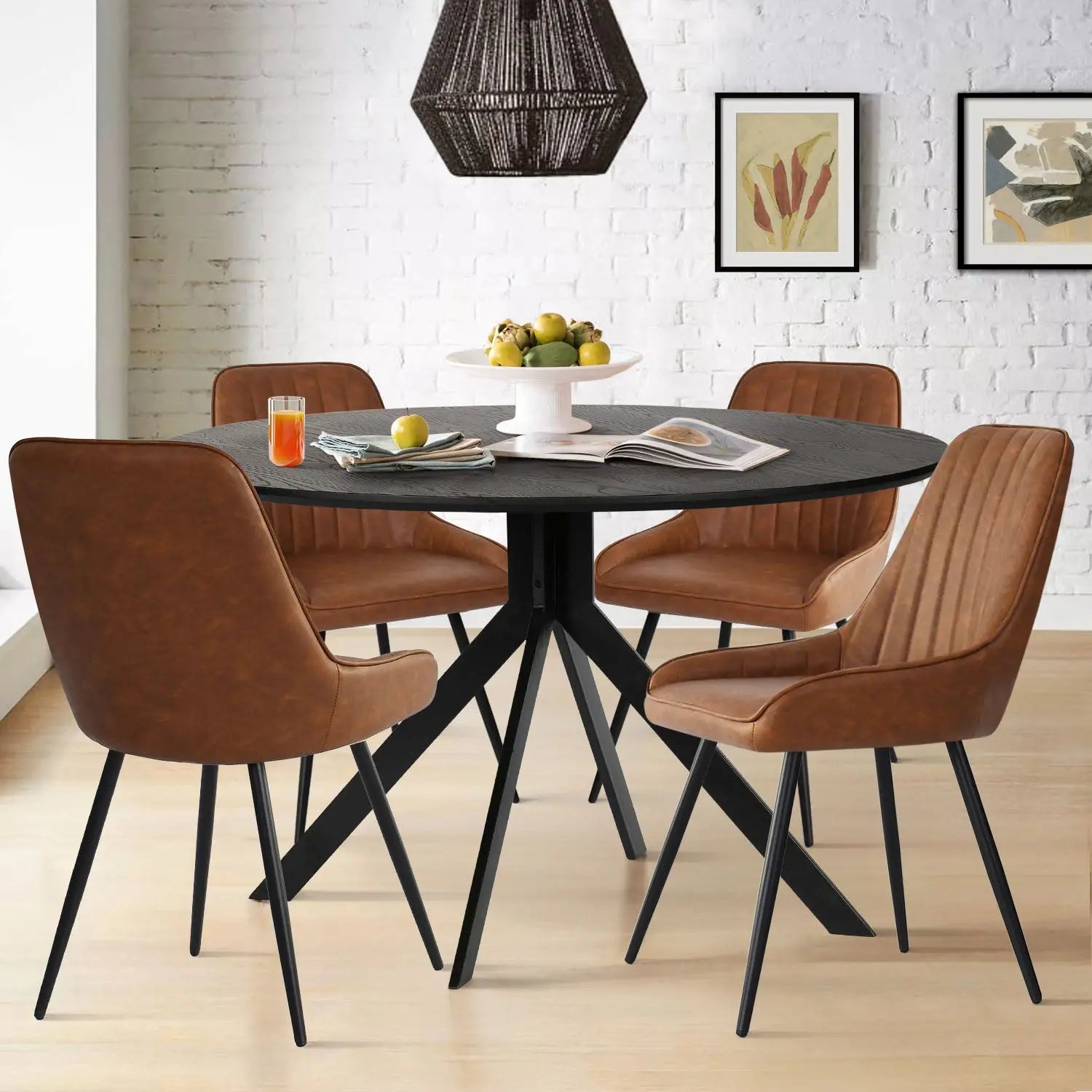 Jonesbo & Boston black dining set with brown leather chairs, white brick wall, wood flooring, pendant light.