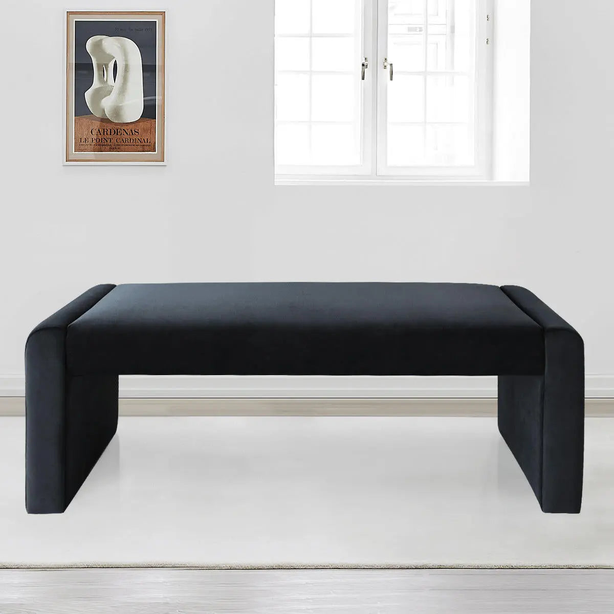 Kaia Modern Leather & Velvet Waterfall Bench in white room with framed abstract art, light flooring.