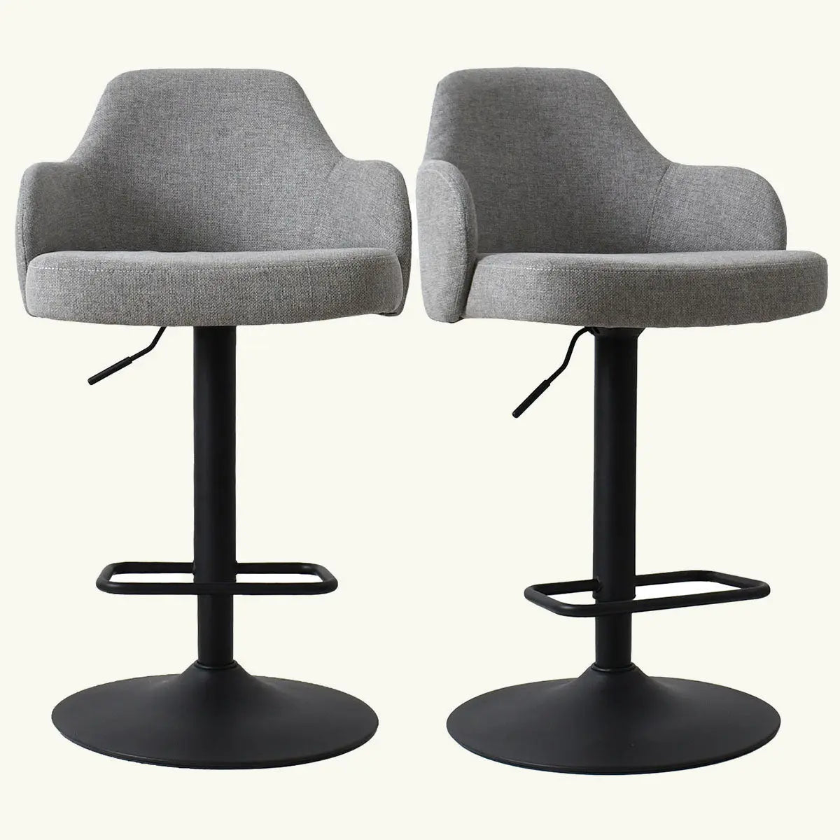 Set of gray upholstered swivel stools with arms, adjustable height, black base, residential seating solution.